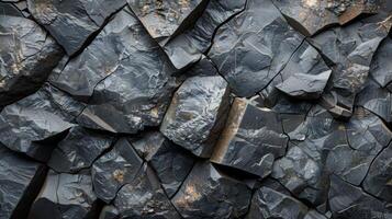 The rugged surface showcases polished dark volcanic rocks with sharp edges and varied textures, capturing the dynamic nature of geological processes over time. photo