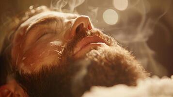 A man enjoys a soothing spa treatment, lying back as steam envelops him, creating an atmosphere of peace and relaxation in a serene setting. photo