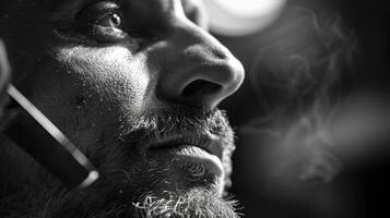 A person gazes intently while holding a device near their ear, with soft smoke curling upward in a moody atmosphere, highlighting details on their face and in the background. photo