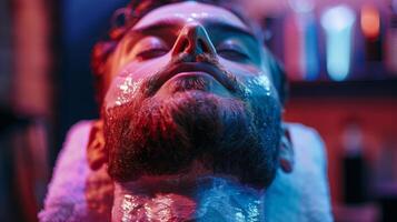 A young man lies back with a slick facial mask applied to his skin, surrounded by vibrant colored lights in a tranquil spa setting, enhancing relaxation and self care. photo