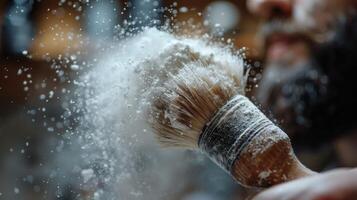 A bearded man rhythmically swirls a shaving brush filled with foam, surrounded by a warm, rustic atmosphere. Morning light floods the room as he readies for a traditional shave. photo