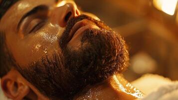A man is experiencing a facial treatment at a spa, enjoying the soothing application of a skincare product while lying back in a tranquil environment. photo