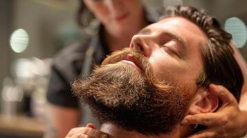 A man relaxes in a stylish barbershop while a professional stylist expertly trims and shapes his beard, creating a polished look in a contemporary setting. photo