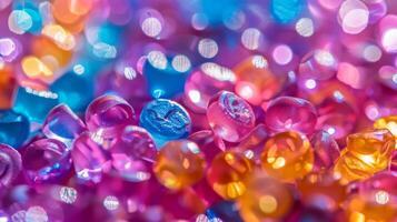 Vibrant glass beads in various colors are scattered across a surface, reflecting light and creating a dazzling display of hues that captures attention and adds charm. photo