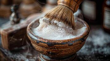 A natural bristle brush whips up a creamy lather in a rustic bowl, showcasing the art of traditional grooming in a cozy atmosphere at home. photo