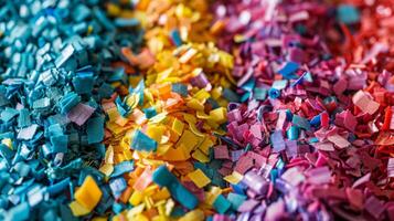 Brightly colored paper pieces in various shades are spread across a workspace, showcasing an artistic arrangement that emphasizes creativity and craft during daytime hours. photo