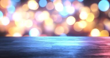 A blurred, colorful bokeh background with a dark surface in the foreground. photo