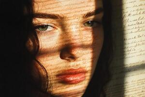 A close-up of a woman's face with shadows and text overlay. photo