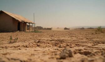 A dusty landscape with a simple structure in a dry environment. photo