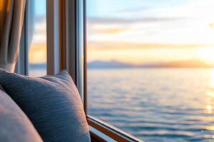 Cozy interior view of a sunset over calm water from a window. photo