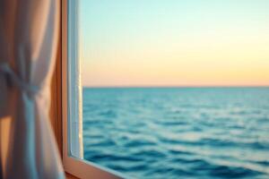 Serene view of the ocean at sunset through a window. photo