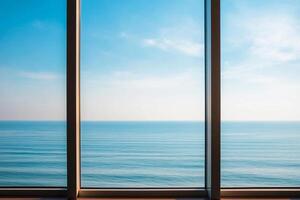 A serene view of the ocean through large glass windows. photo