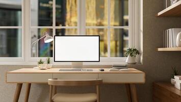 A front view of a computer on a minimalist wooden desk by the window in a contemporary apartment. photo