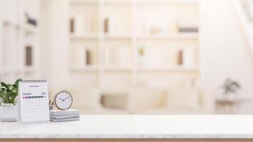 A desk with decorative items and empty space for display products, set in a minimalist living room. photo