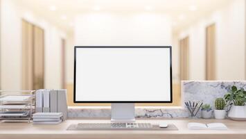 A computer and decorative items set on a modern reception counter at the building entrance. photo