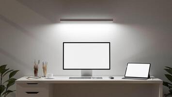 A minimalist white office features a computer and a digital tablet set on a desk. photo