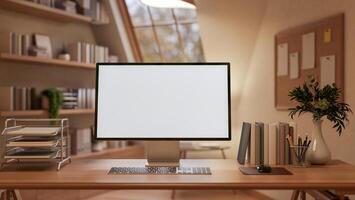A White screen computer on the wooden table with decorative items, Workspace with glass window. photo