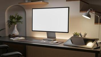 A white screen computer with graphic tablet and decorative item on the wooden table beside the aisle. photo