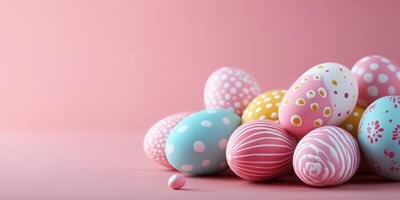 Colorful decorative eggs arranged on a pink background for a festive spring celebration photo