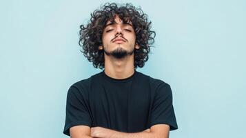 Young Man With Curly Hair Wearing Black T Shirt photo