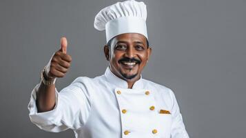 Happy Male Chef Giving Thumbs Up Approval photo