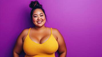 Happy Plus Size Woman Posing Against Purple Background photo