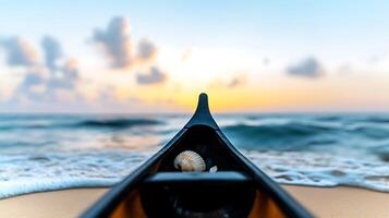 A serene sunset view from a kayak on a tranquil beach, featuring a seashell in the foreground photo