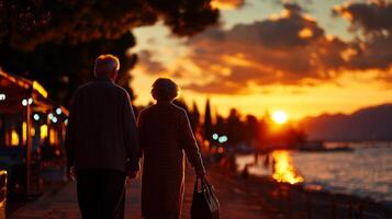 elderly Caucasian couple strolls together along beach during sunset their hands intertwined surrounded warm serene atmosphere created golden light reflecting on water photo