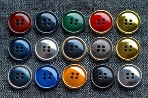 Top down view displays neat arrangement of vibrant buttons set against textured fabric backdrop ideal for branding and creative projects inspire new designs photo