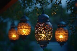 Moroccan lanterns hang elegantly casting enchanting patterns of light against serene blue backdrop dusk. Their intricate designs celebrate tradition and craftsmanship photo