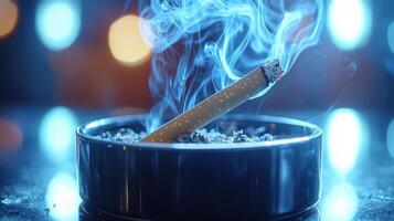 cigarette burns slowly releasing smoke intertwines into skull shape above sleek black ashtray. scene powerfully highlights dangers of smoking's harmful effects photo