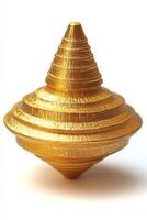 A shiny gold spinning top with a sleek, intricate design, set against a clean white background. photo