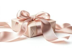 A beautifully wrapped gift box adorned with a soft pink satin ribbon, exuding elegance and charm. photo