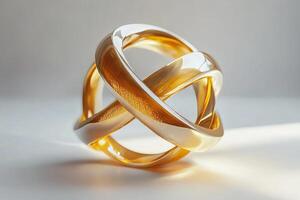 An elegant interwoven sculpture featuring shiny gold and silver tones, showcasing modern design and craftsmanship. photo