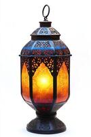 Intricate ornate lantern showcasing warm amber and gold hues, perfect for creating a cozy atmosphere. photo