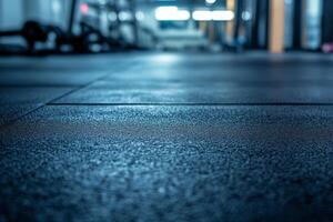 Close-up of a gym floor with textured rubber tiles, creating a modern and dynamic atmosphere. photo