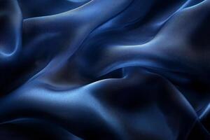Close-up of luxurious dark blue silk fabric, showcasing its smooth texture and elegant drape. photo