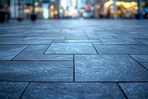 A close-up view of a textured stone pavement in a bustling urban setting, conveying a modern and inviting atmosphere. photo