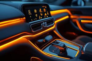 Interior view of a modern vehicle featuring sleek controls and vibrant orange ambient lighting. photo