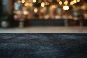 A close-up of a textured dark surface, with a softly blurred background showcasing warm bokeh lights. photo