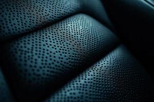 Close-up of luxurious dark leather seating with intricate perforation patterns. photo