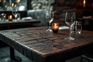 Elegant dining setup with polished glasses on a rustic wooden table, creating a cozy atmosphere in a dimly lit restaurant. photo