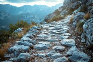 A scenic rocky path winding through mountainous terrain, showcasing natural beauty and serene surroundings. photo