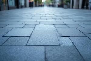 Close-up view of a smooth, patterned stone pavement in an urban setting, creating a serene and inviting atmosphere. photo