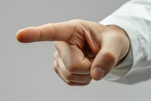 A close-up of a male hand pointing forward, symbolizing direction or emphasis. photo
