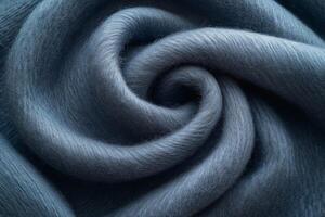 Close-up of soft, swirling blue fabric, showcasing its texture and luxurious feel. photo