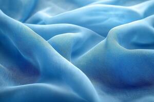 Soft and flowing blue fabric draped elegantly, creating a serene and calming atmosphere. photo