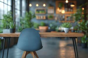 A modern workspace featuring a stylish chair facing a wooden table amidst lush greenery. photo