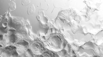 Close-up view of water droplets on a textured surface, creating intricate patterns. photo