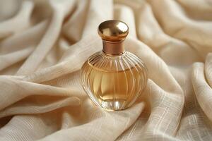 An elegant perfume bottle resting on soft, crumpled fabric, exuding luxury and allure. photo